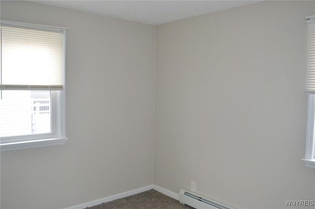 unfurnished room featuring carpet flooring, a textured ceiling, and a baseboard radiator