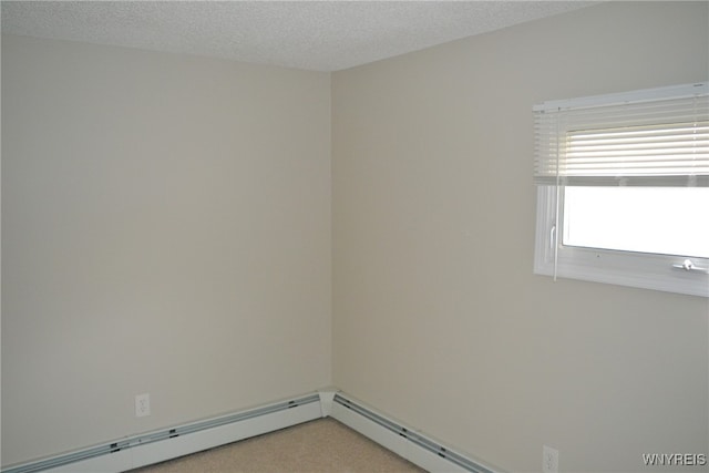 carpeted spare room featuring a textured ceiling and a baseboard heating unit