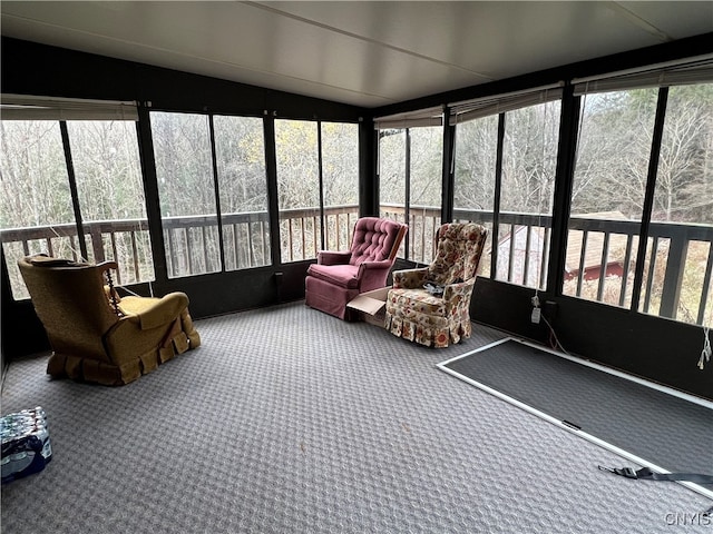 sunroom / solarium with lofted ceiling and a wealth of natural light