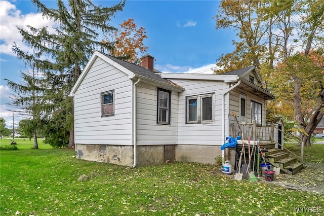 view of home's exterior featuring a lawn