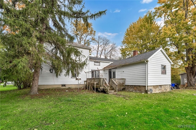 back of property featuring a yard and a deck