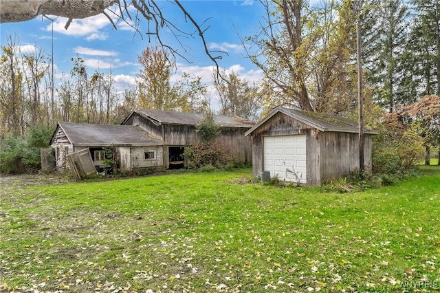 exterior space with a yard and an outdoor structure