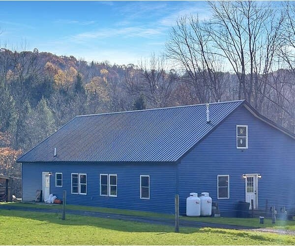 view of property exterior with a lawn