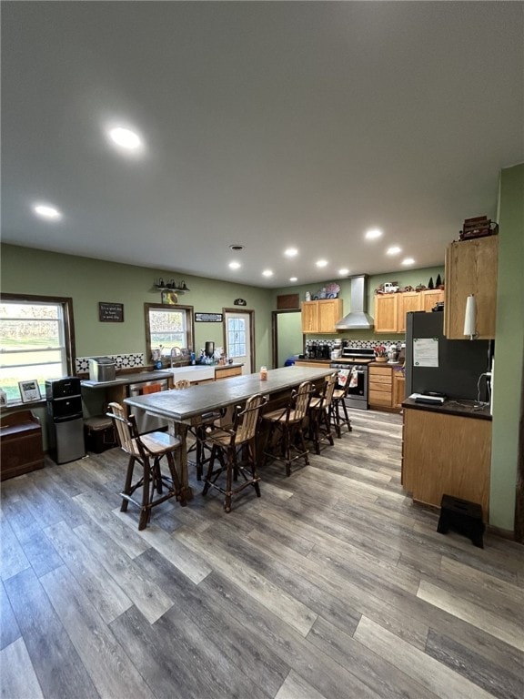 dining space featuring sink and light wood-type flooring