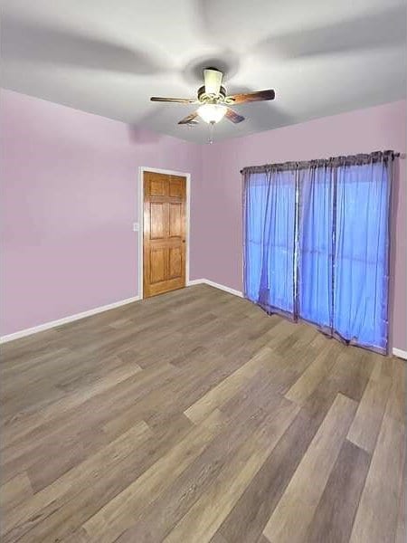 unfurnished room featuring wood-type flooring and ceiling fan