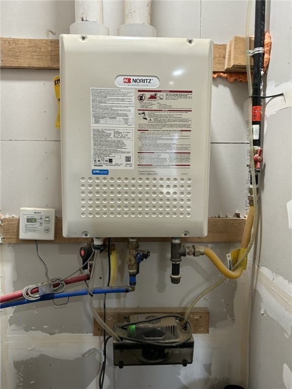 utility room with water heater