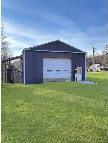 garage with a lawn