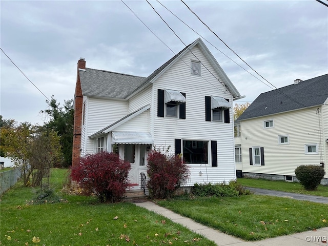 view of front of home with a front lawn