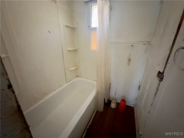 bathroom featuring a tub to relax in