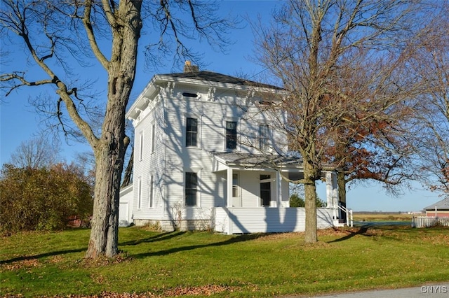 32693 Schell Rd, Le Ray, NY 13637 - view of front of property featuring a front lawn, covered porch, and a chimney