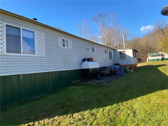 rear view of property with a yard