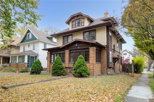 view of front of property with a sunroom