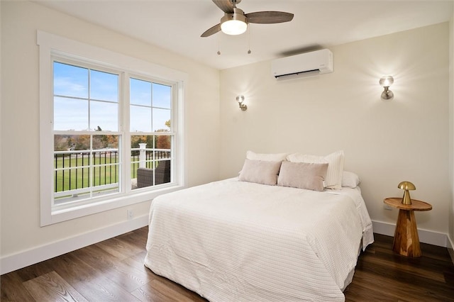 bedroom with ceiling fan, dark hardwood / wood-style floors, multiple windows, and a wall mounted AC