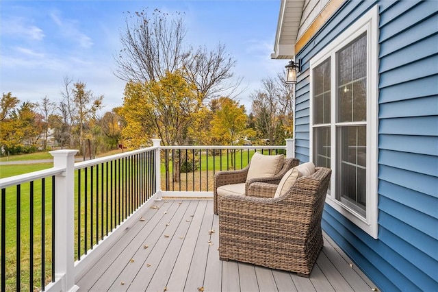 wooden deck featuring a yard