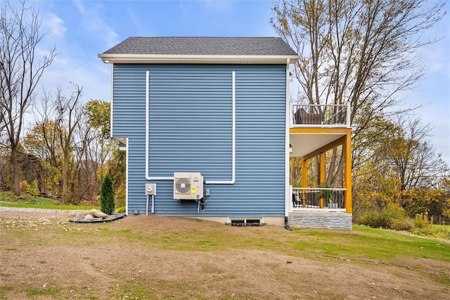 view of home's exterior with a balcony