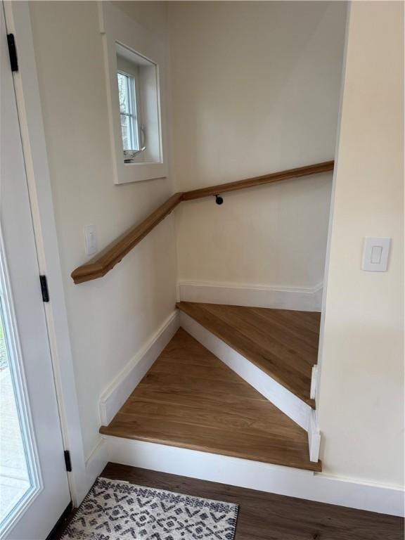 stairway featuring hardwood / wood-style flooring