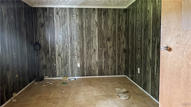 unfurnished room with wooden walls