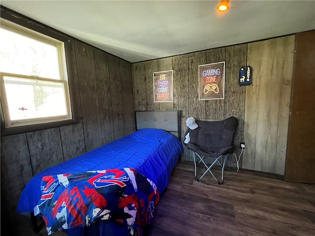 bedroom with dark hardwood / wood-style floors