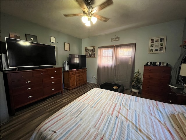 bedroom featuring dark wood-type flooring and ceiling fan