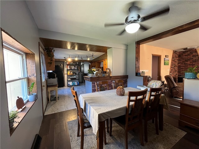 dining space featuring hardwood / wood-style flooring and ceiling fan