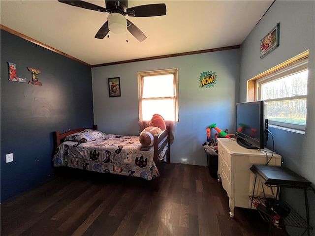 bedroom with ceiling fan, dark hardwood / wood-style floors, and crown molding