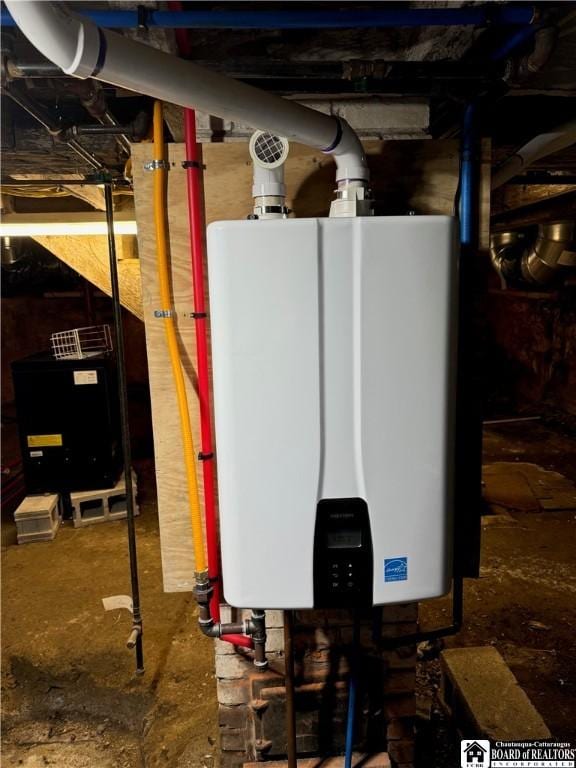 utility room with tankless water heater