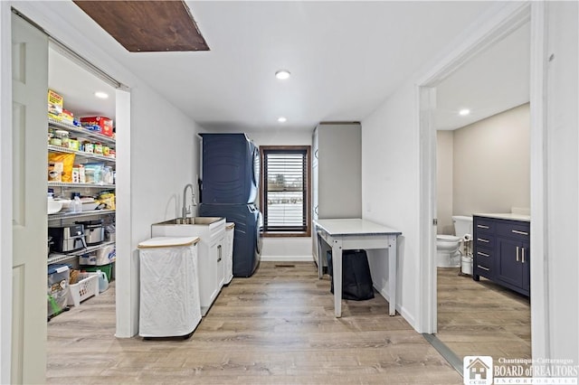 kitchen with light hardwood / wood-style floors and blue cabinets