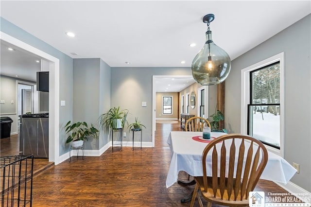 dining space with dark wood-type flooring