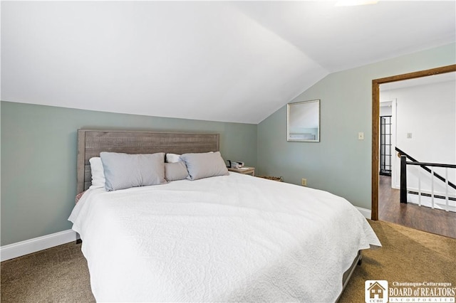 carpeted bedroom featuring vaulted ceiling