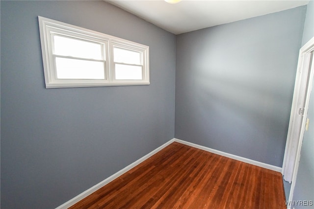 spare room with hardwood / wood-style floors