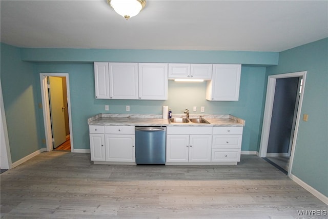 kitchen featuring dishwasher, light wood-type flooring, white cabinetry, and sink