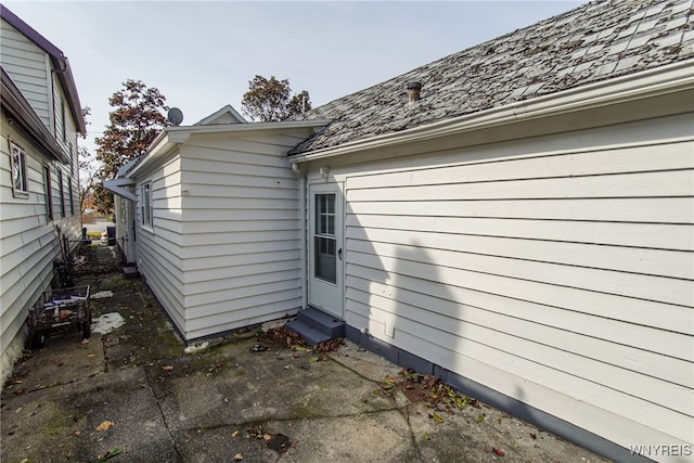 view of property exterior with a patio area