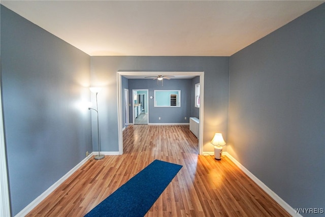 corridor featuring hardwood / wood-style floors