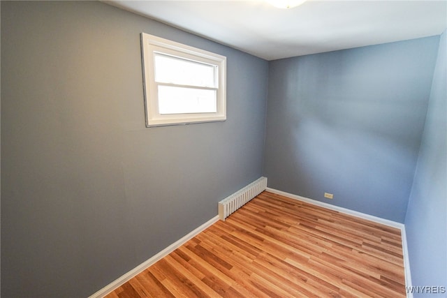 spare room featuring light hardwood / wood-style flooring