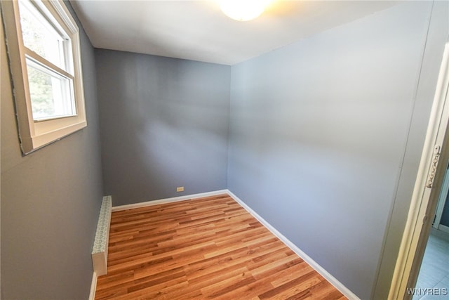 spare room featuring light hardwood / wood-style flooring