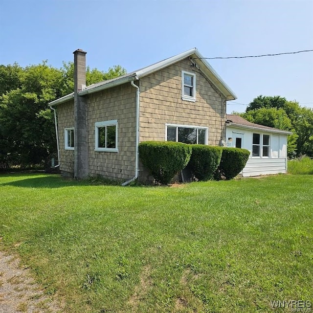 view of home's exterior featuring a lawn