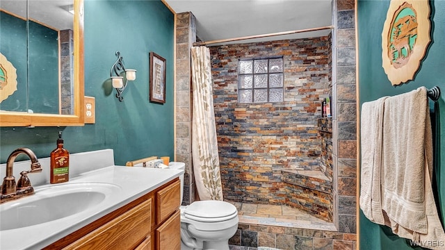 bathroom with vanity, toilet, and a shower with curtain