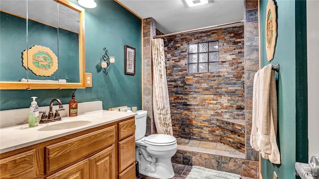 bathroom with toilet, a shower with curtain, vanity, and tile patterned floors