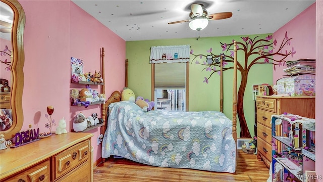 bedroom featuring ceiling fan and light wood-type flooring