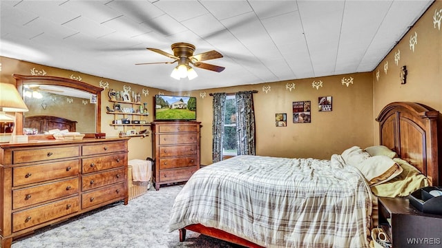 bedroom featuring ceiling fan and light colored carpet