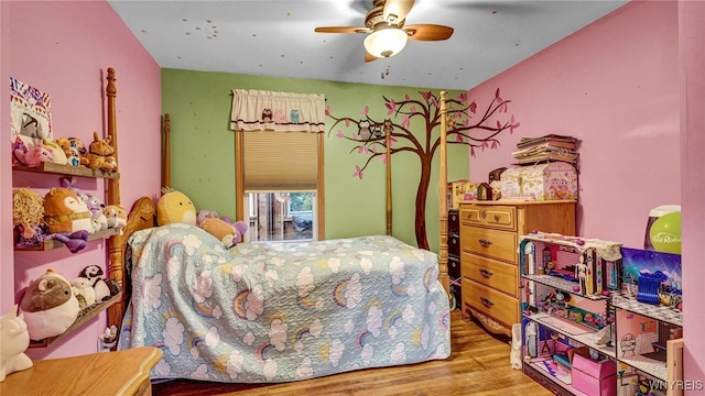 bedroom with ceiling fan and light wood-type flooring