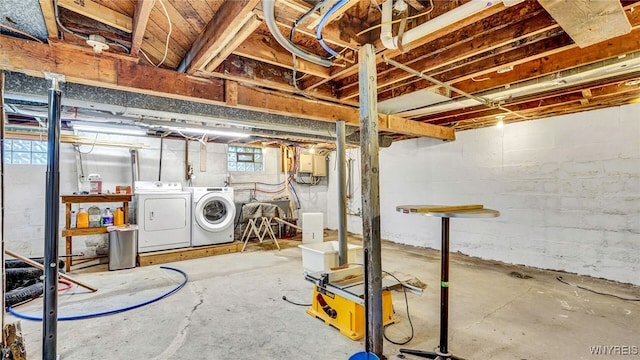 basement featuring washing machine and clothes dryer