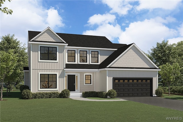 view of front of home featuring a front yard and a garage