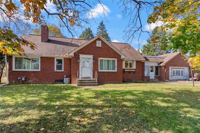 ranch-style house featuring a front yard and cooling unit