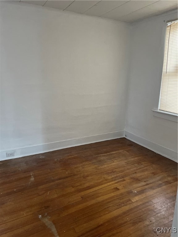 unfurnished room featuring dark wood-type flooring