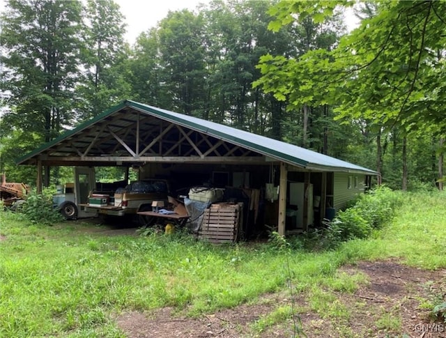 view of vehicle parking featuring a carport