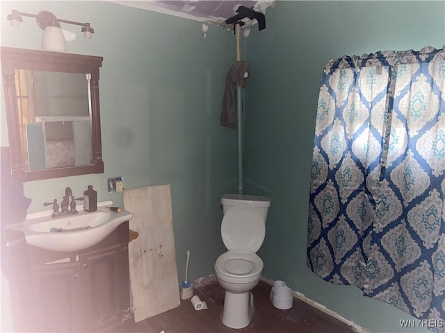 bathroom with toilet and vanity