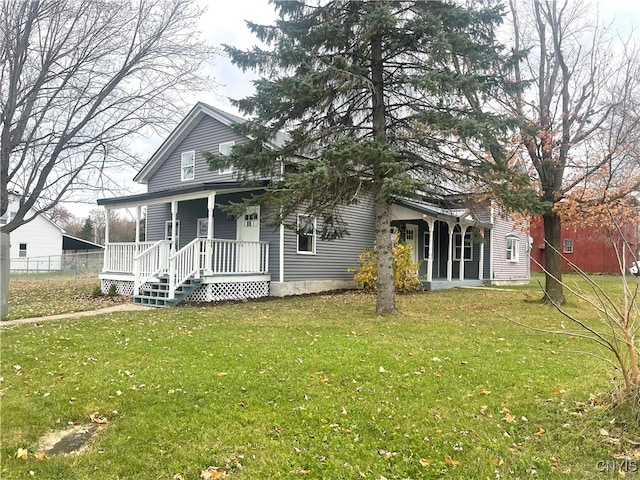 view of front facade featuring a front yard and covered porch