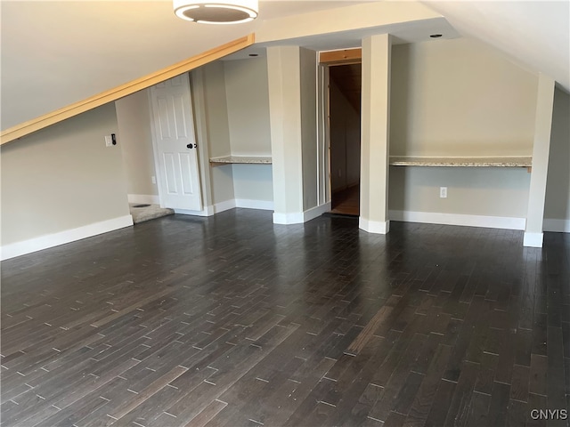 bonus room with dark hardwood / wood-style flooring