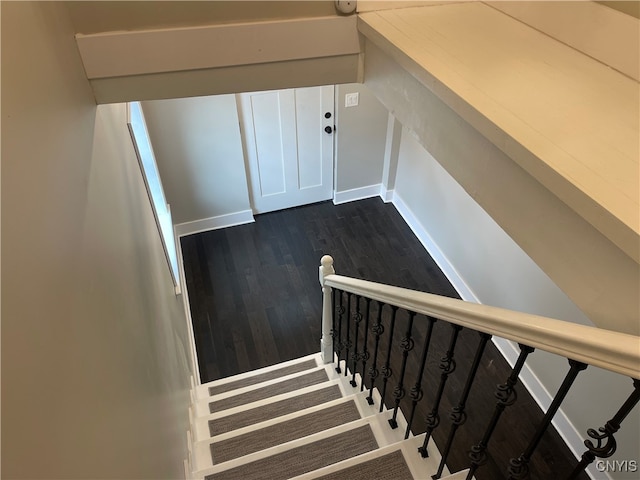 stairway featuring hardwood / wood-style floors